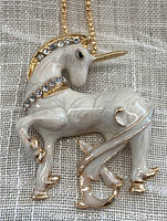 Front view of the Betsy Johnson unicorn pendant necklace showing clear rhinestones and glossy enamel finish