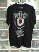 Front of black The Who T-shirt showing large graphic with text and target design