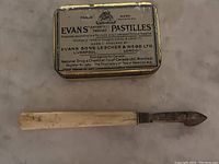 George Wostenholm IXL cutlery piece with worn handle and blade, showing Civil Service Canada stamp.