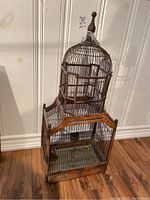 Full view of the antique decorative birdhouse showing entire structure and condition.