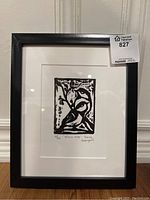 Framed relief art print with black frame visible, showing overall lot contents.