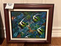 Framed mixed media painting showing underwater scene with angelfish and aquatic plants.
