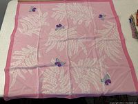 Pink silk scarf featuring white fern leaves and multicolor butterflies with pink border, signed Hanae Mori