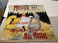 Silk scarf with Moulin Rouge concert poster design in red, black, yellow and white colors.