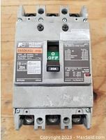 Front view of grey molded case circuit breaker showing ON/OFF switch, labels, and specifications.