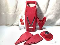 Full set of original Borner V5 mandoline parts including main slicer unit, 3 blades, safety holder, hand guard and manual laid out on white background.