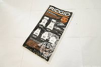 Packaged unopened Ridgid disposable dust bags for vacuum cleaners, visible labeling of size 12-16 gallons.