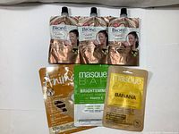 Lot overview showing 3 Biore clay mask packs and 3 different facial sheet masks: Anima Lemon, Masque Bar Brightening with Vitamin C, and Masque Bar Banana.