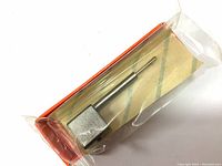 Mitutoyo SPH-11 Contracer Stylus sealed in plastic with square base and slender angled tungsten carbide tip.