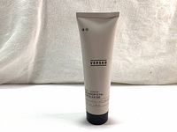 Front view of the sealed 90ml tube of Versed Day Maker Microcrystal Exfoliator showing the brand, product name, and volume.