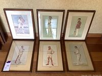 Overview photo showing all six framed athlete art prints arranged on the floor, depicting vintage cricket players in various poses and attire.