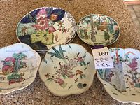 Five plates arranged on countertop showing overall lot