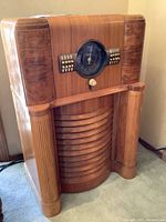 Front view of Zenith wood console radio showing Art Deco styling