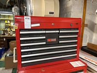 Red steel toolbox closed, front view with drawers