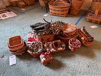 Group photo of all Longaberger Christmas baskets showing variety of shapes, sizes and fabric liners.