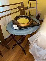 Luggage rack with three wall mirrors on top showing frames and condition