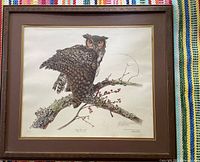 Framed print of a barn owl perched on a branch, double matted with dark brown wooden frame.