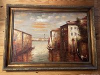 Frontal view of the large oil painting showing the Venice canal scene with gondolas and buildings under a partly cloudy sky. Visible texture and palette knife thick application of paint.