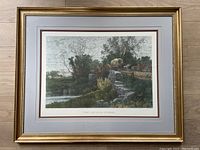 Full view of framed print showing the artwork and frame, titled 'The Old Mill Stream', by A.F. Bellows