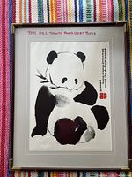Full front view of framed panda exhibit poster showing the panda art, vertical text, and frame.