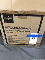 Photo of the cardboard box with label showing Medline Ultrasorb B3136 bed liner size 30x36 inches, quantity 40.