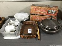 Full set showing five pewter wine glasses, Pyrex serving dish with wicker basket, ceramic olive boat, four white soup bowls, and boxed Watertown Beef 'N Brew set.