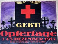 Front of the WW1 German Red Cross poster showing the red cross symbol, black background, and German text in red and gold.