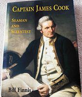 Front cover of the first book 'Captain James Cook Seaman and Scientist' showing a painted portrait of Cook in period naval uniform.