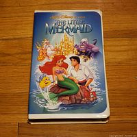 Front cover of The Little Mermaid VHS case showing colorful character illustrations