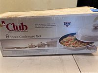 Photo of the original packaging box showing brand name Club and 8 Piece Cookware Set.