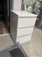 White 3-drawer cabinet closed, showing smooth thermofoil finish and edges