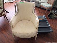 Front angled view of the tub chair showing upholstery and whitewashed wood frame.