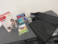 Photo showing all items in lot including the corset tummy shaper and boxed tension relieving products.