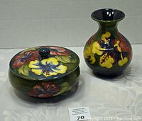 Photo of the covered dish and vase showing colorful raised hibiscus pattern and overall appearance of the set