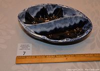 Top view of the Blue Mountain Pottery split dish showing granite glaze in black and blue with speckled pattern and divider in the middle