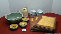Photo of assorted pottery and wooden plaques