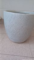 Side view showing textured diagonal line pattern and large size.