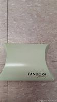 Closed Pandora branded light green box packaging for jewelry
