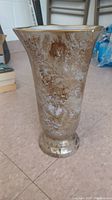 Side view of the ceramic vase showing texture and color variations