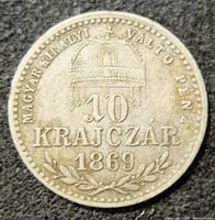 Obverse of the silver 1869 Hungary 10 Krajczar coin showing the crowned denomination and year with decorative elements.