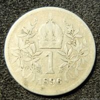 Obverse side of 1896 Austria One Corona silver coin showing crowned '1' and laurel design with date.
