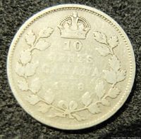 Reverse side of the silver 1918 Canadian 10 cents coin showing crowned denomination 10 Cents with wreath design.
