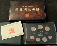 Overall view of the complete 2003 Royal Canadian Mint Specimen Coin Set with box, booklet, and coin case showing the coins inside.