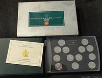 Full display of the collector's box, booklet, and coin case
