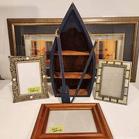 All items in the lot, showing the wooden boat shelf and five picture frames, some with placeholder paper and some with prints