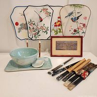 Full collection shot including pottery ramen set, fans, chopsticks, and framed silk