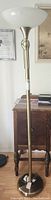 Full view of the floor lamp showing the frosted glass bowl shade and brass pole extending to a height of approximately 72 inches.