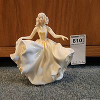Front view of Royal Doulton 'Sweet Seventeen' figurine showing detailed dress and pose.