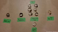 All rings laid out and grouped by material and size with labels