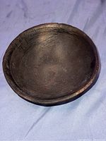 Top view of antique ancient bowl showing slightly uneven rim and smooth inner surface